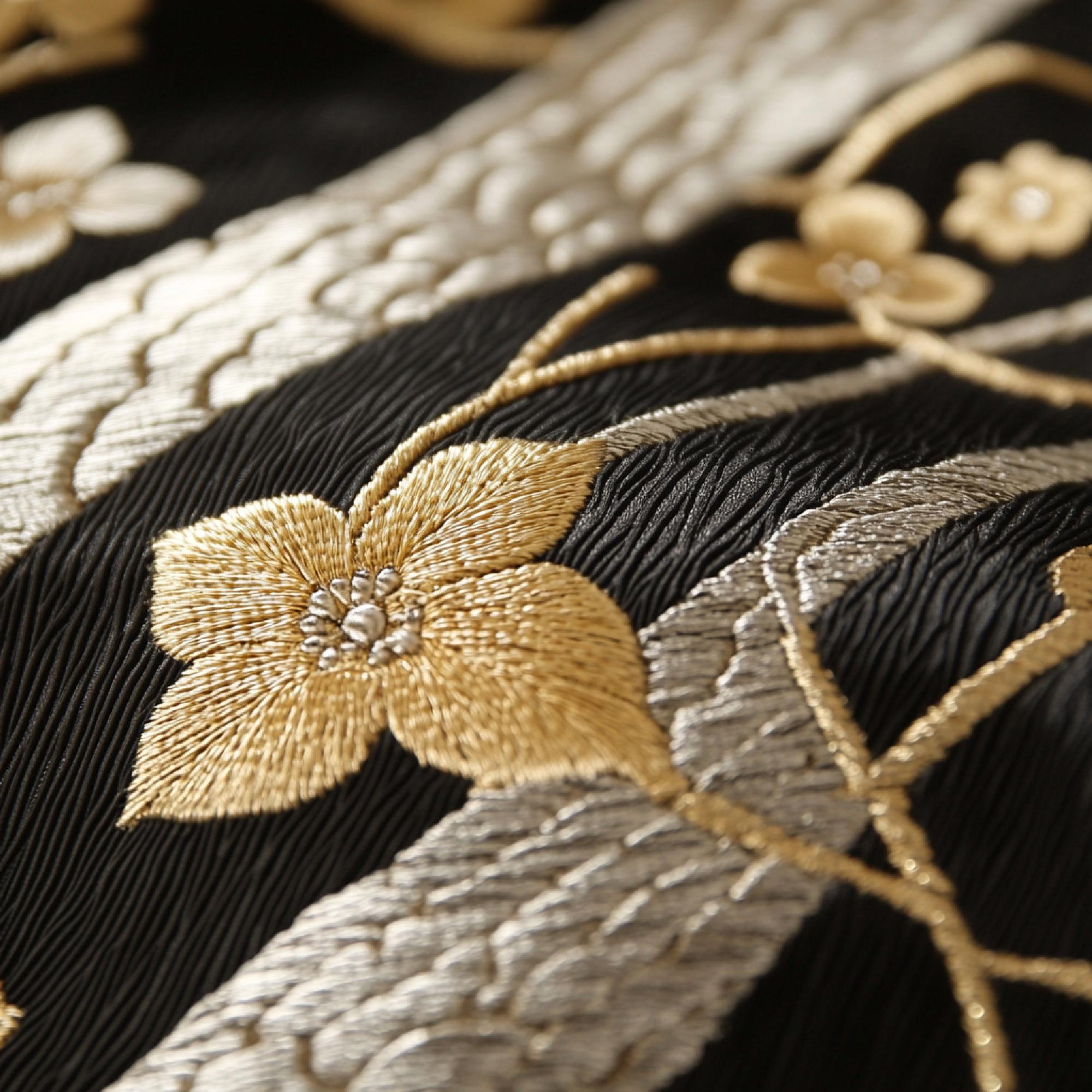 Detail of gold thread embroidery on silk